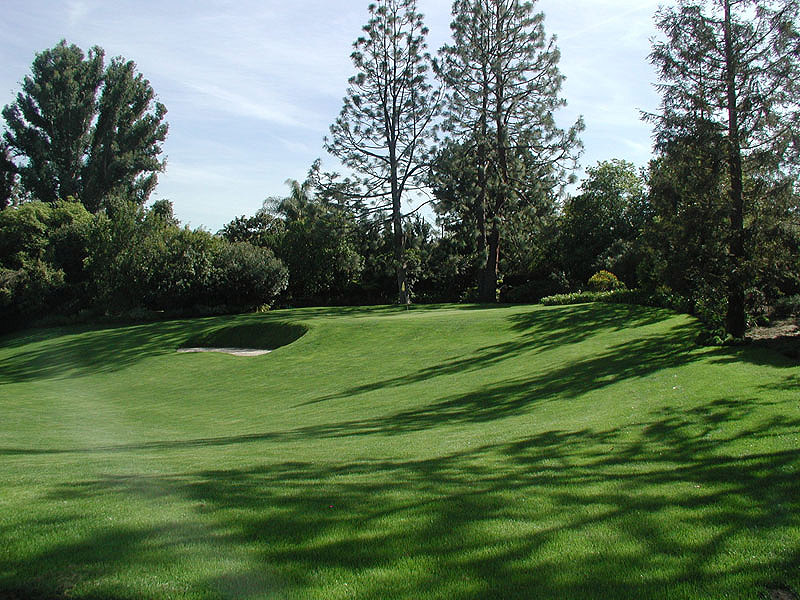 Private putting green with sand bunker on residential estate